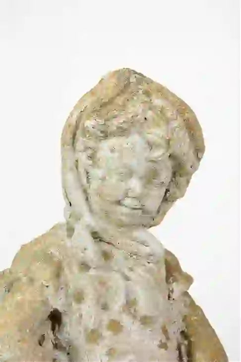 Pair of Small Cast Stone Figures